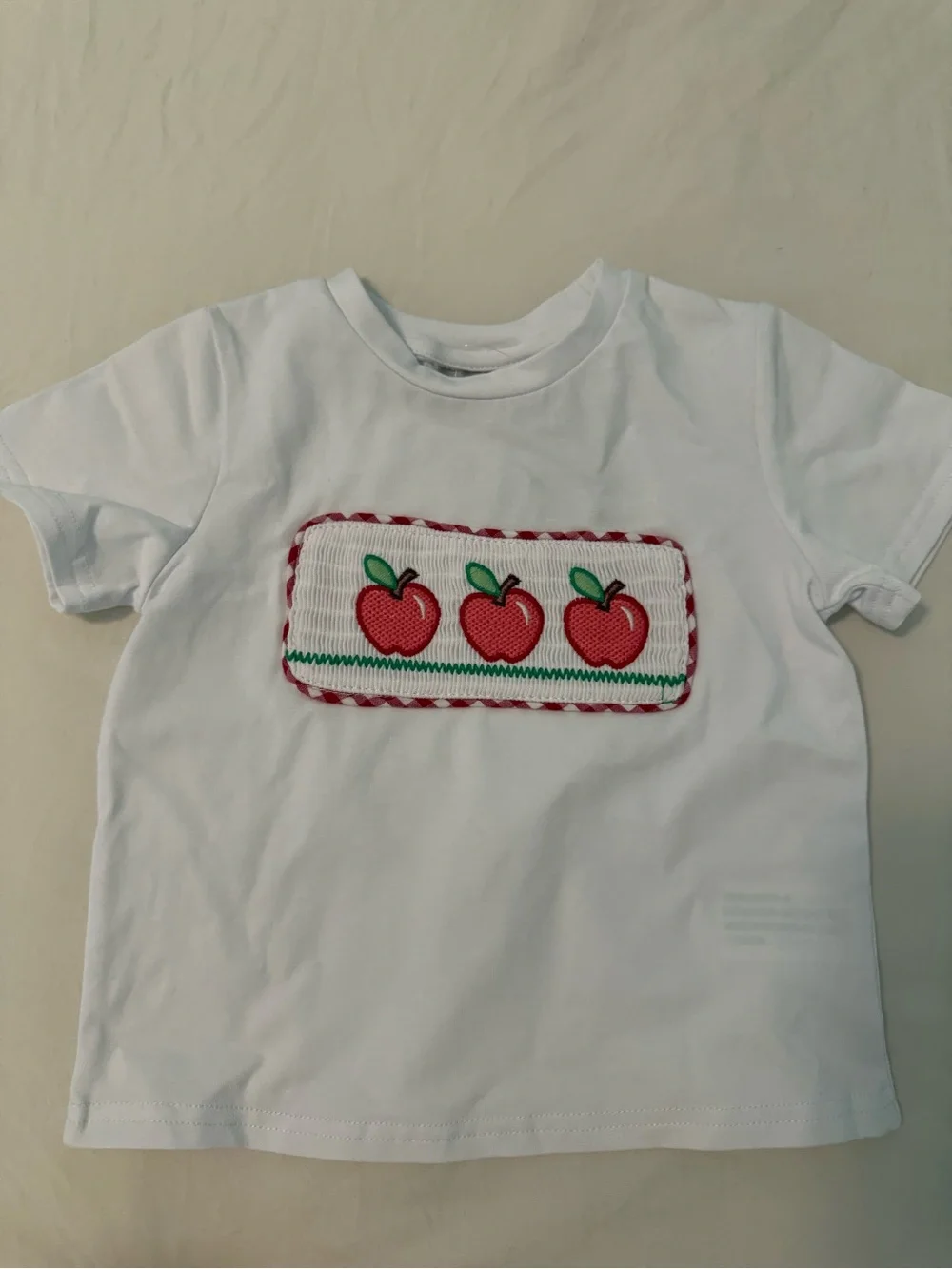 Embroidered set. Red apples and gingham red and white short. So cute!